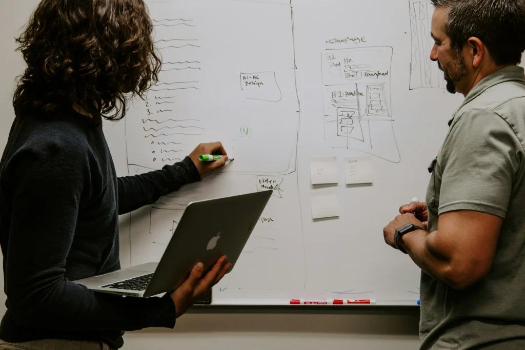 Strategic business consulting session with executives reviewing data and growth strategies